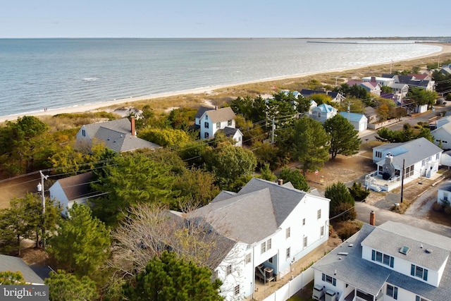 bird's eye view featuring a water view and a beach view