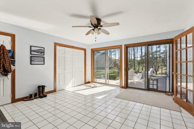 interior space featuring ceiling fan and a healthy amount of sunlight