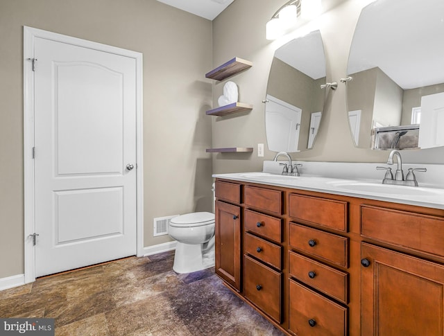 bathroom with vanity and toilet