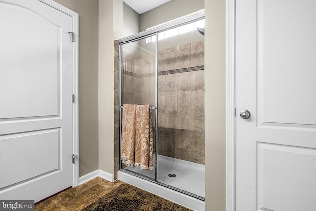 bathroom with a shower with shower door