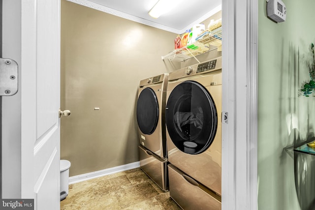 laundry room featuring independent washer and dryer and ornamental molding