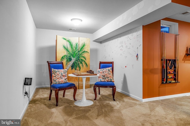 sitting room with carpet floors