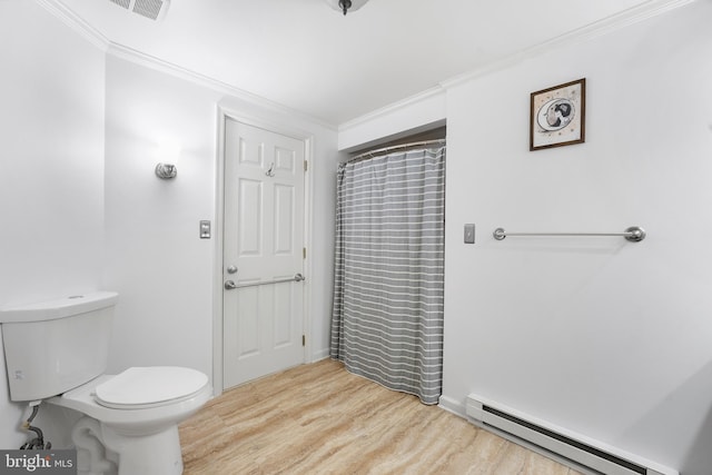 bathroom with toilet, ornamental molding, hardwood / wood-style flooring, and a baseboard radiator