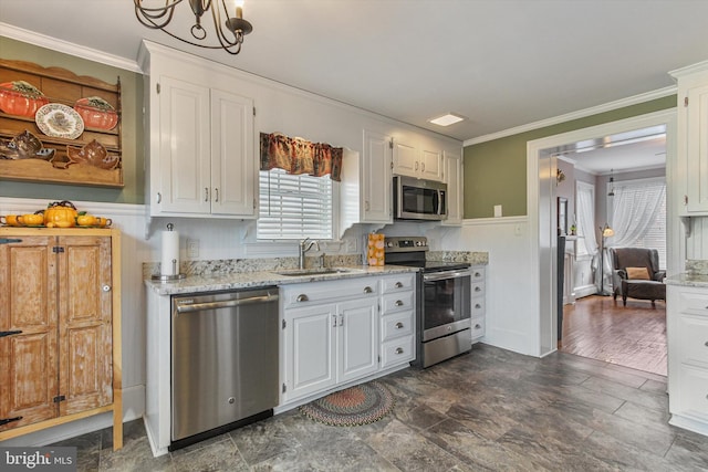 kitchen with stainless steel appliances, ornamental molding, sink, white cabinets, and dark hardwood / wood-style flooring