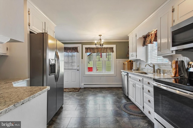 kitchen with white cabinetry, stainless steel appliances, sink, and plenty of natural light