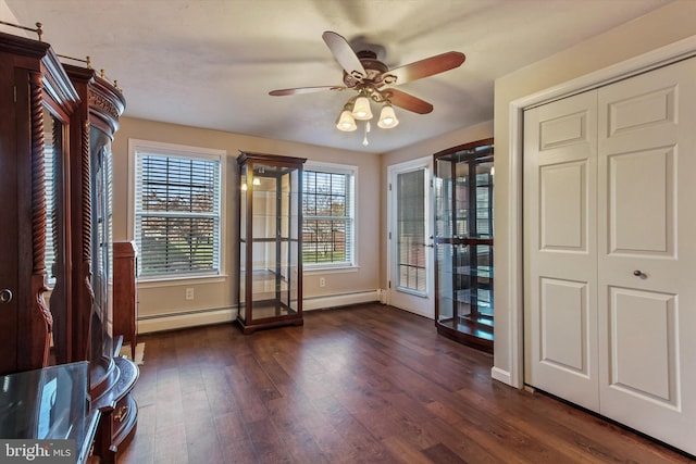 spare room with ceiling fan and dark hardwood / wood-style flooring