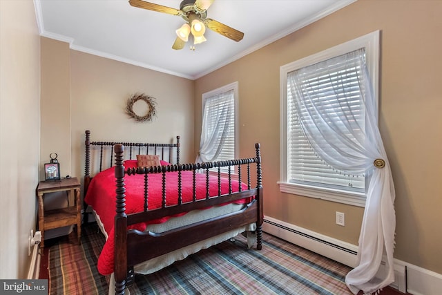 bedroom featuring ornamental molding, baseboard heating, and ceiling fan