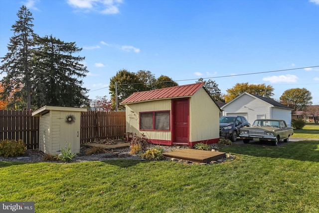 view of outdoor structure with a lawn