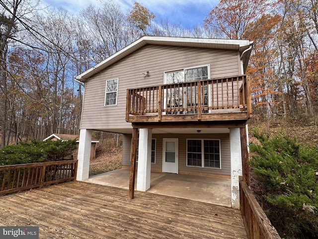 wooden terrace featuring a patio area