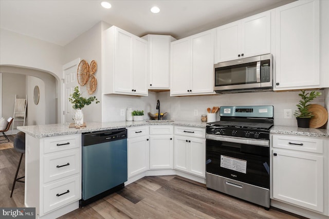 kitchen featuring white cabinetry and stainless steel appliances