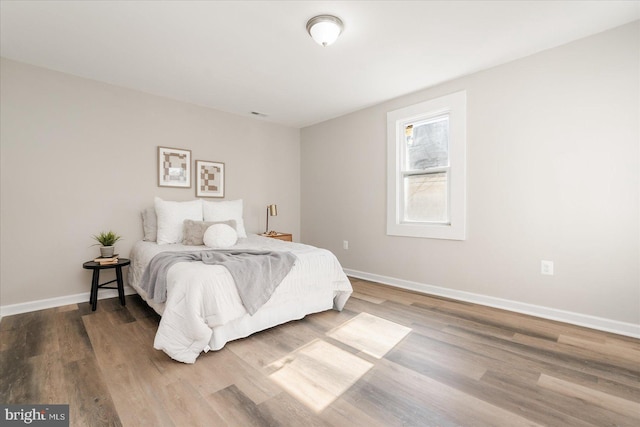 bedroom with wood-type flooring