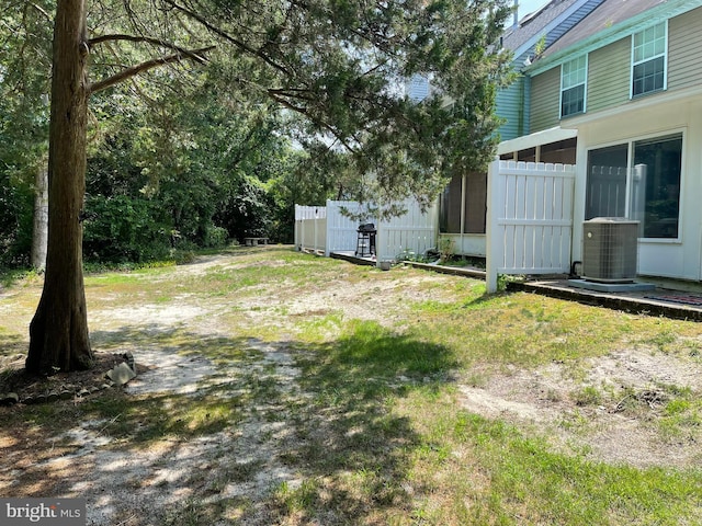 view of yard with central air condition unit