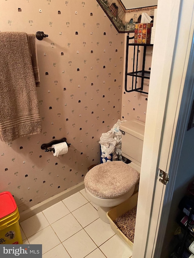 bathroom featuring tile patterned floors and toilet