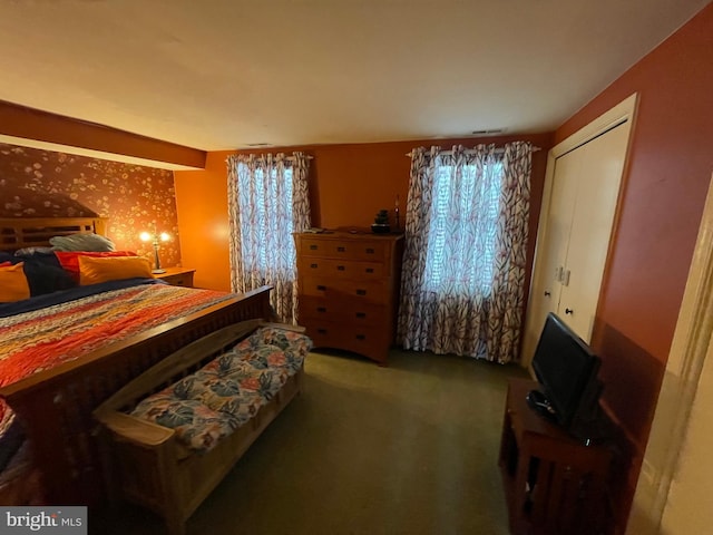 carpeted bedroom featuring a closet