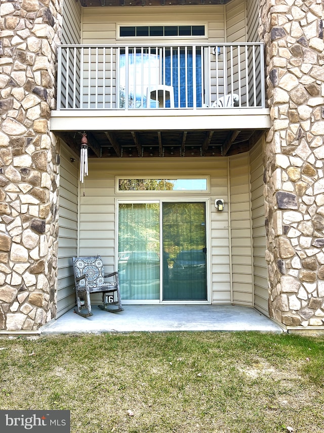 entrance to property with a balcony