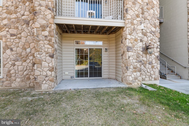 entrance to property with a balcony