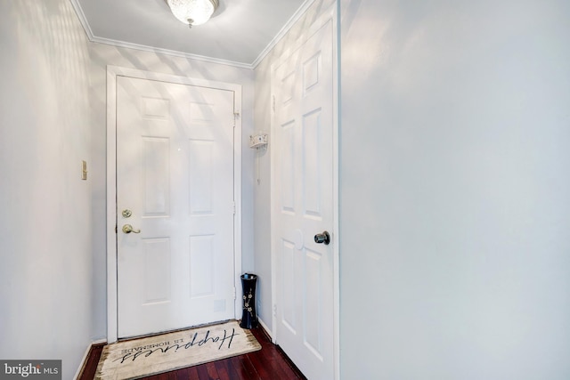 doorway to outside with dark hardwood / wood-style floors and crown molding