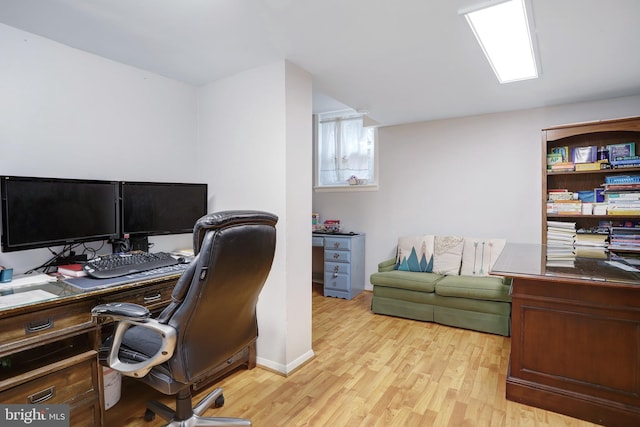 office space with light hardwood / wood-style floors