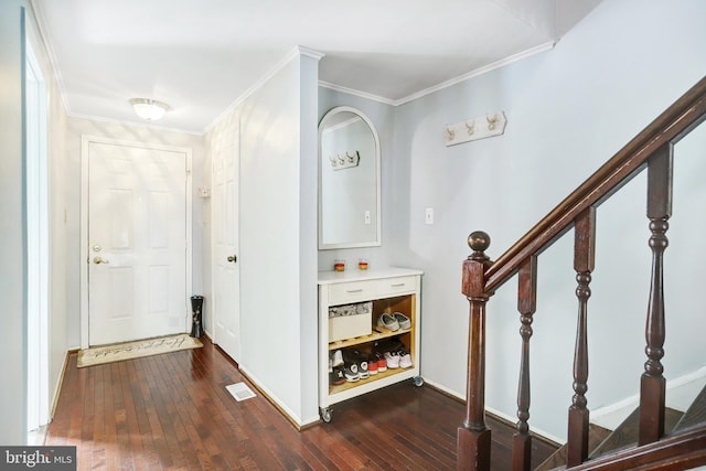 hall featuring dark hardwood / wood-style floors and ornamental molding