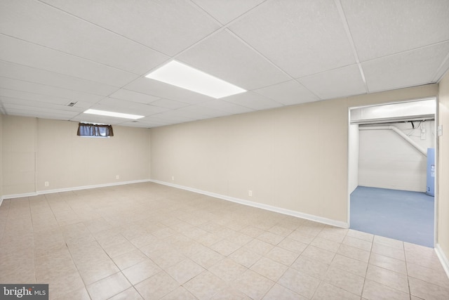 basement featuring a drop ceiling