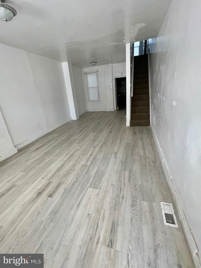 basement with light wood-type flooring