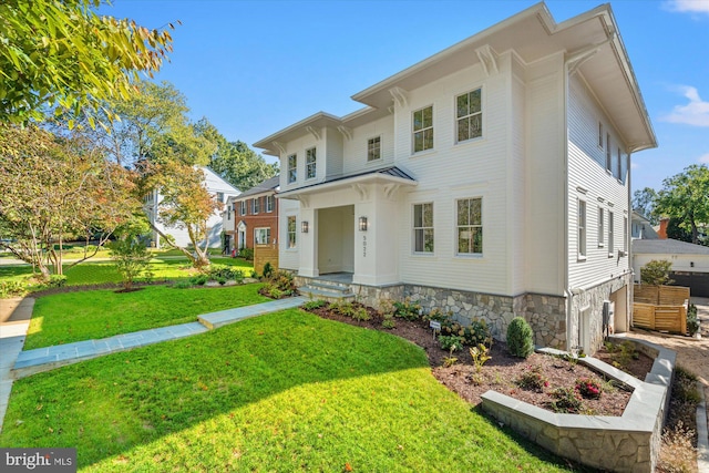 view of front of home with a front lawn