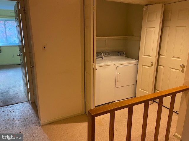 washroom featuring independent washer and dryer and light colored carpet