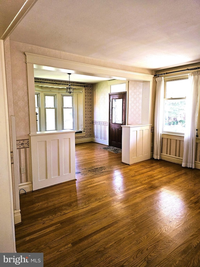 spare room with dark hardwood / wood-style floors