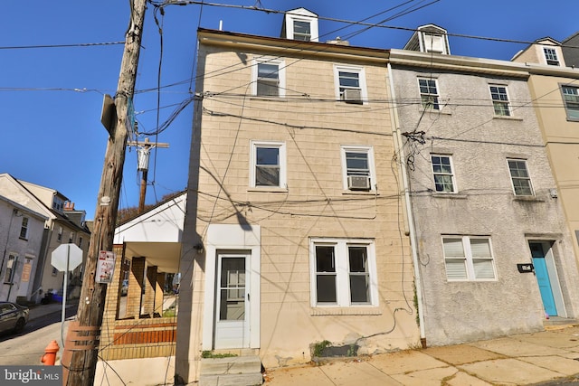 view of front of home with cooling unit