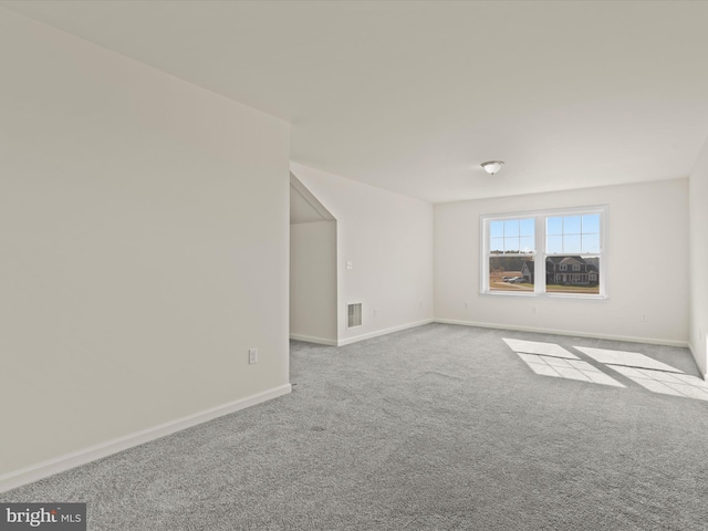 spare room with light colored carpet