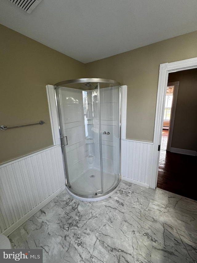 bathroom featuring an enclosed shower