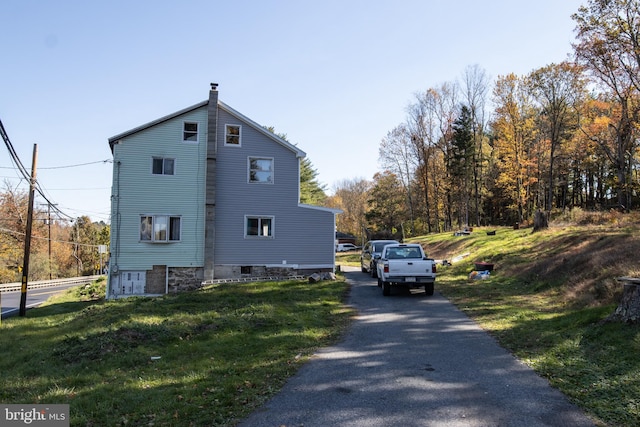 view of home's exterior featuring a yard