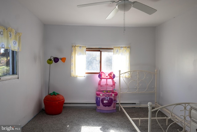 bedroom featuring ceiling fan and baseboard heating