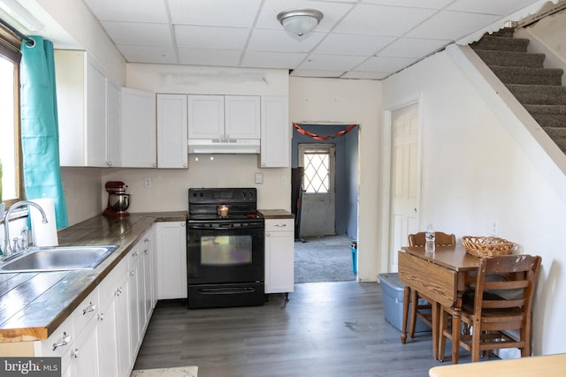 kitchen with white cabinetry, a healthy amount of sunlight, and black electric range oven