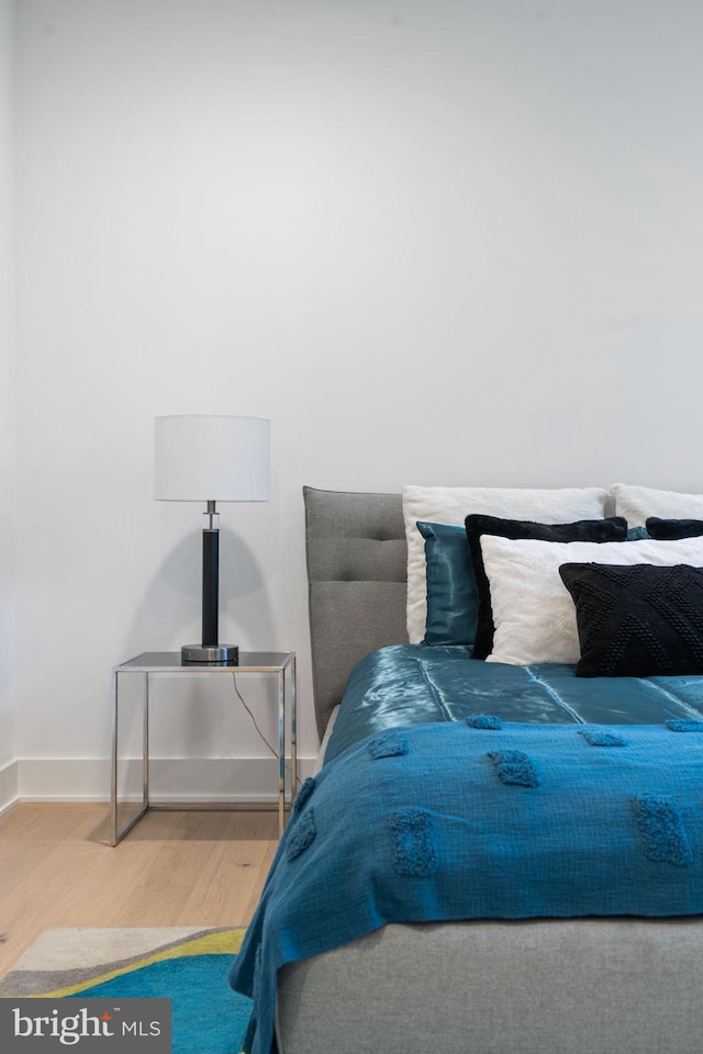 bedroom with hardwood / wood-style floors