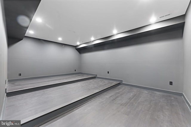 unfurnished room with wood-type flooring