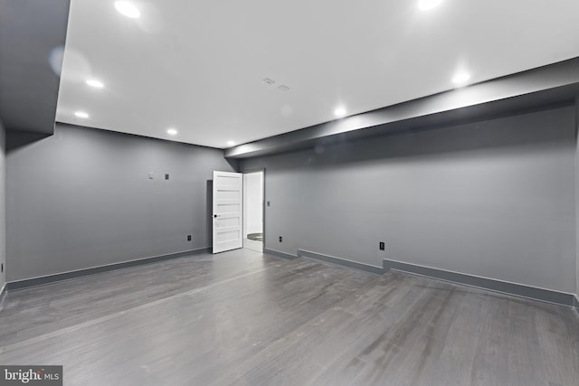 basement featuring hardwood / wood-style floors