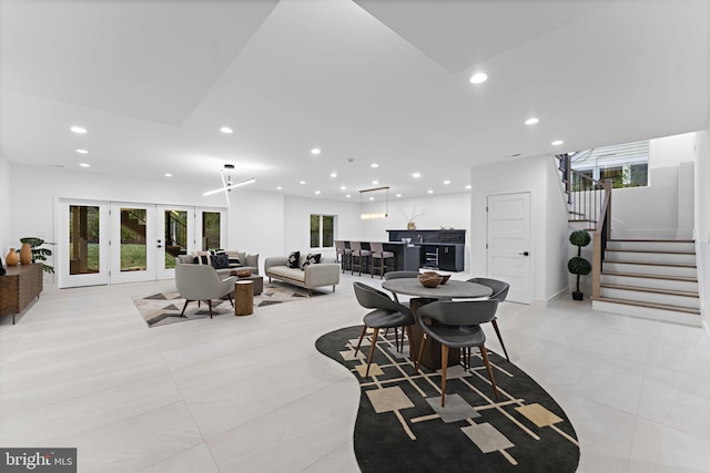 dining room featuring french doors and light tile patterned floors