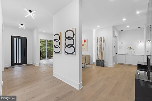 entryway with light hardwood / wood-style flooring