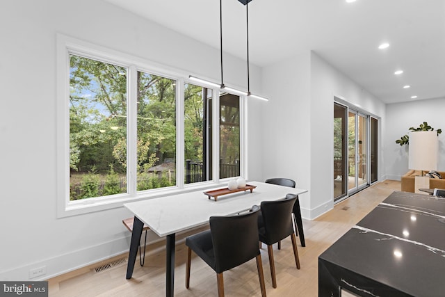 dining room with light hardwood / wood-style floors