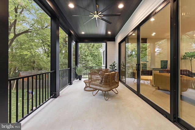 sunroom / solarium with ceiling fan