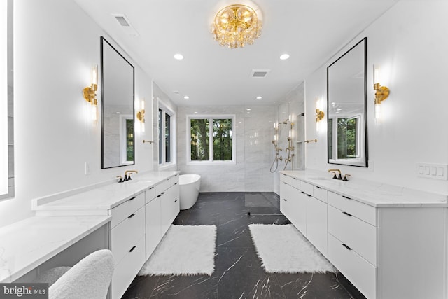 bathroom with vanity and separate shower and tub