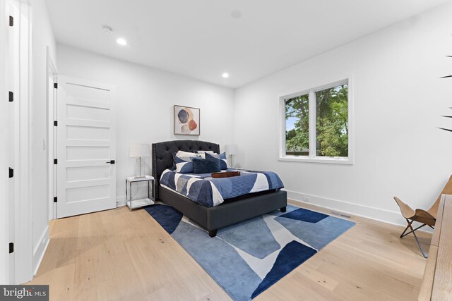 bedroom with hardwood / wood-style floors