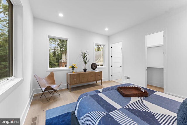 bedroom with light hardwood / wood-style floors