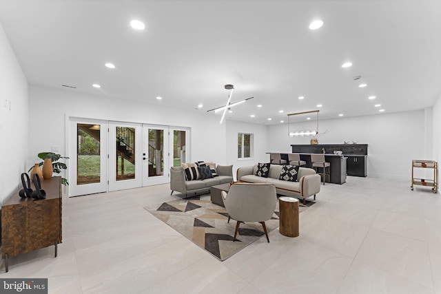 living room featuring bar and french doors