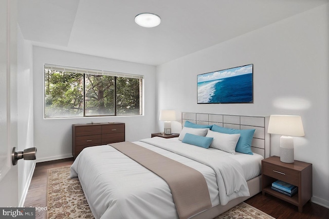 bedroom featuring dark hardwood / wood-style floors