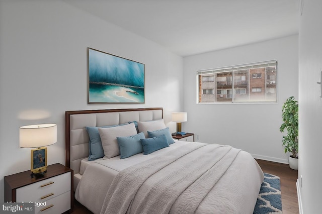 bedroom featuring dark wood-type flooring