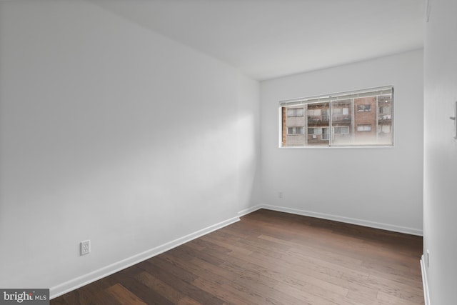 empty room featuring wood-type flooring