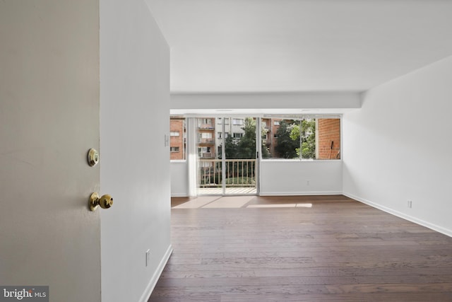 spare room with hardwood / wood-style flooring