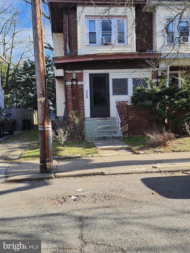 view of front of house featuring cooling unit